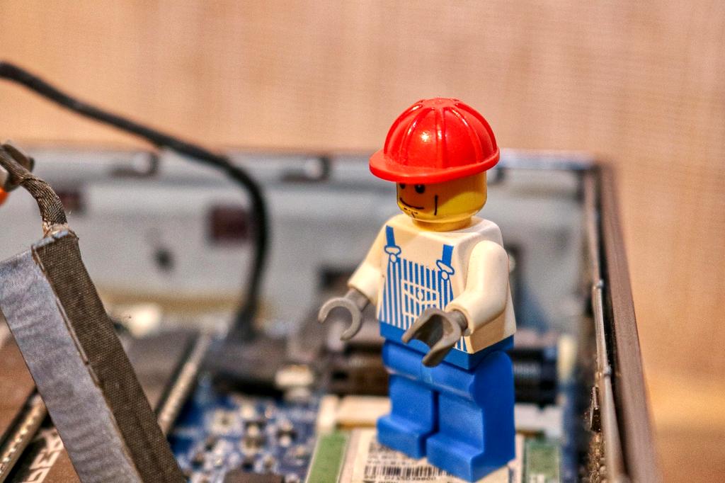 Technician working on laptop repairs