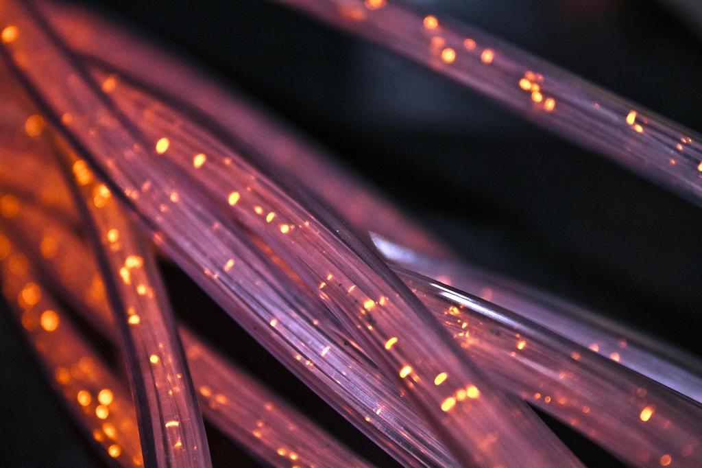 Abstract 3D visualization of neural network connections glowing in blue and purple